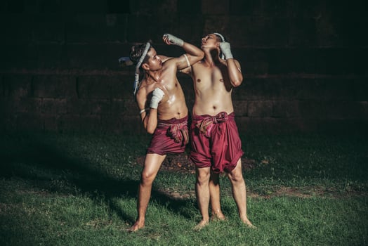 Two boxers fight with the martial arts of Muay Thai. photo