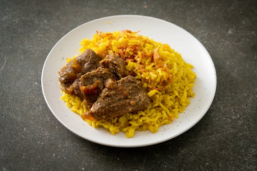 Beef Biryani or Curried rice and beef - Thai-Muslim version of Indian biryani, with fragrant yellow rice and beef photo