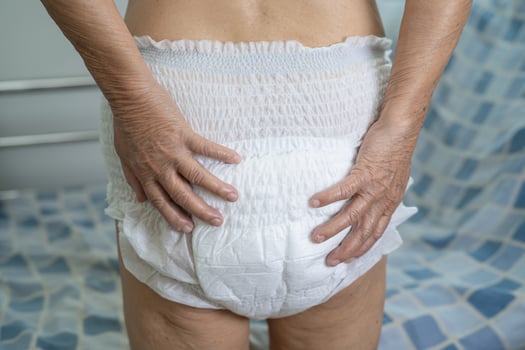 Asian senior or elderly old lady woman patient wearing incontinence diaper in nursing hospital ward, healthy strong medical concept. photo