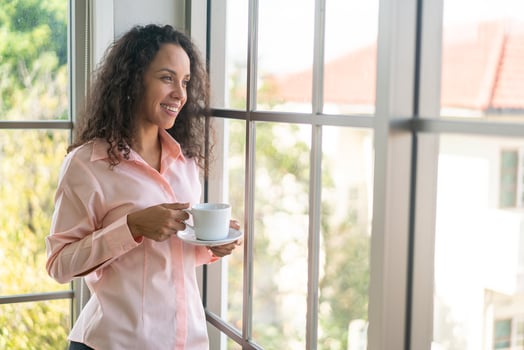 beautiful latin woman drinking coffee photo