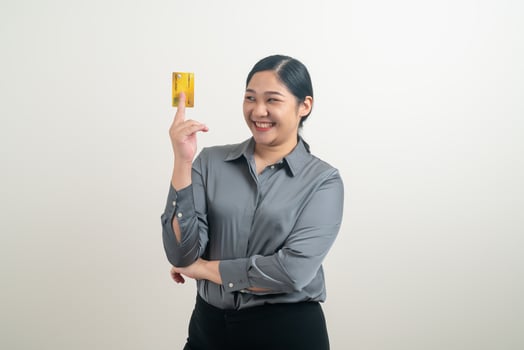 Asian woman holding credit card with white background photo