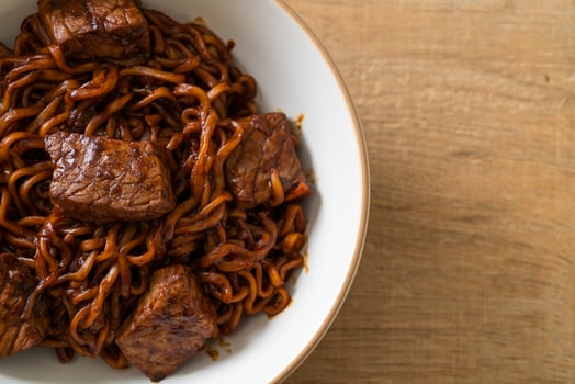 Jjapaguri or Chapaguri, Korean Black Beans Spicy Noodles with Beef photo