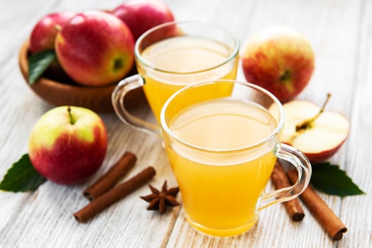 Apple cider  with cinnamon sticks photo