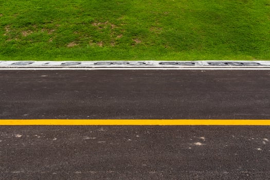 Asphalt road with marking lines white stripes texture Background photo