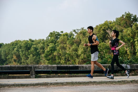 Men and women exercise by running. photo