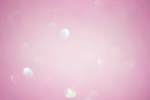 Abstract background blurred focus pink glitter. Pink sparkles defocus light. photo
