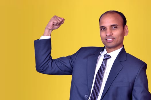 Businessman Standing Showing some achievement Pictures, Images and Stock Photos