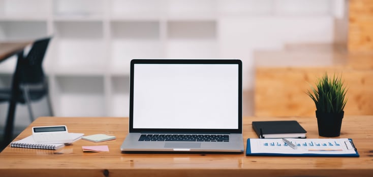 Blank screen Laptop computer and poster workspace background in modern office photo