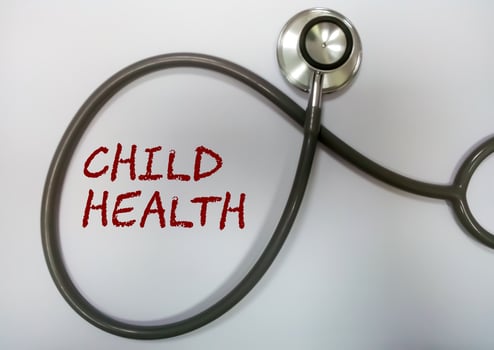 Chlid health term with stethoscope. medical and health concept. photo