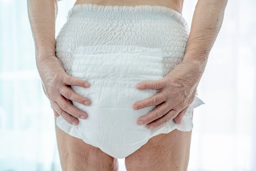 Asian senior or elderly old lady woman patient wearing incontinence diaper in nursing hospital ward, healthy strong medical concept. photo