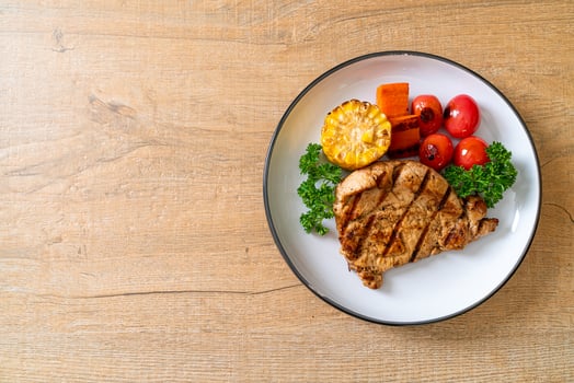 grilled and barbecue fillet pork steak with vegetable photo