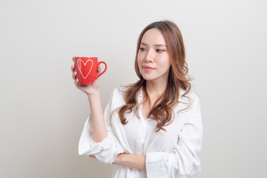 portrait beautiful Asian woman holding coffee cup or mug photo