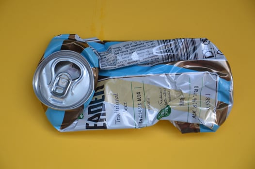 KIEV, UKRAINE - DECEMBER 22, 2021 Crumpled beer cans for scrap photo