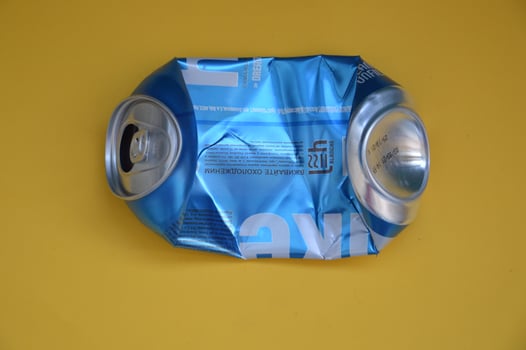 KIEV, UKRAINE - DECEMBER 22, 2021 Crumpled beer cans for scrap photo
