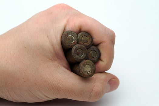 Hand holds the old cartridges. photo