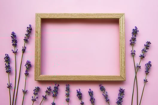 Wooden frame with beautiful flowers of fragrant lavender photo