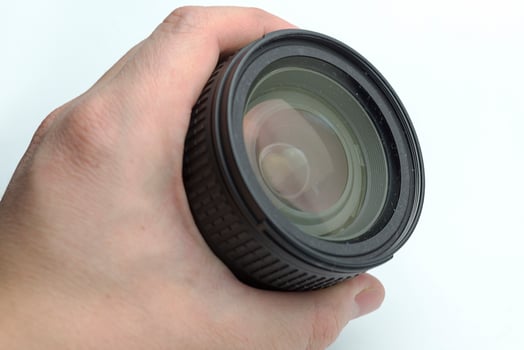 The hand holding the lens. photo