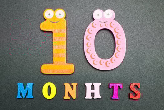 Ten months on a black background. photo