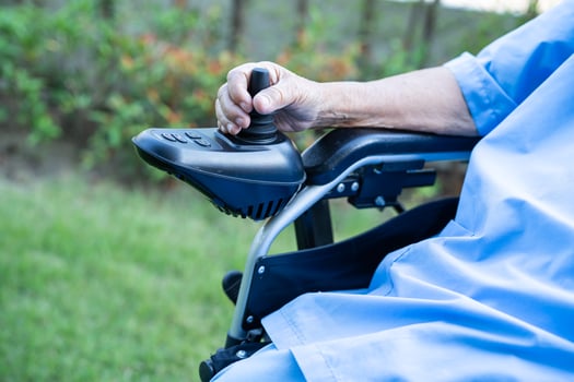 Asian senior or elderly old lady woman patient on electric wheelchair with remote control at nursing hospital ward, healthy strong medical concept photo