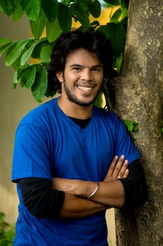 Handsome fashion young man posing outdoors photo