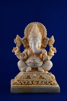 Hindu God Ganesha. Ganesha Idol on blue background photo