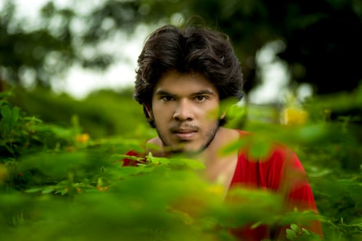 Handsome fashion young man posing outdoors photo