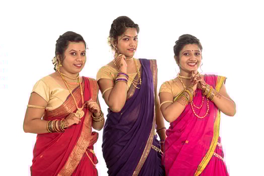 Traditional Beautiful Indian young girls in saree posing on white background photo