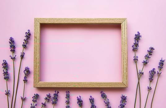 Wooden frame with beautiful flowers of fragrant lavender photo