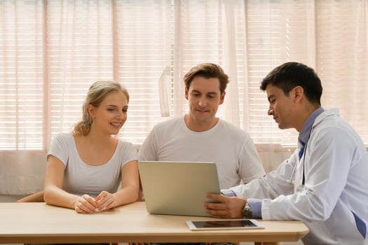 Love couple having infertility problems need advisor with the doctor. photo