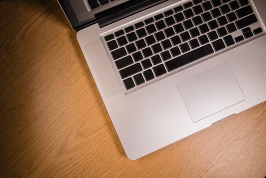 Laptop with blank screen on table photo