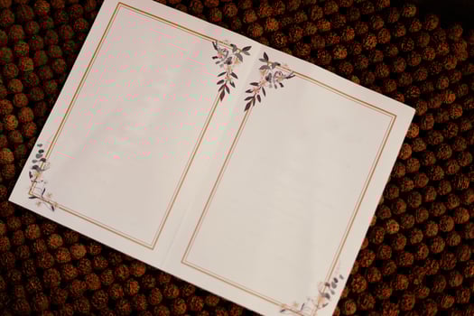 Blank paper on brown cloth background photo