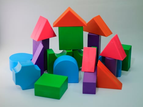 Children's toys building blocks unique and colorful on isolated white background. Education toy for kids. photo