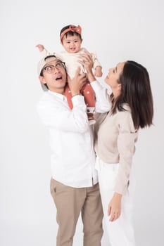 Happy Asian family on white background photo