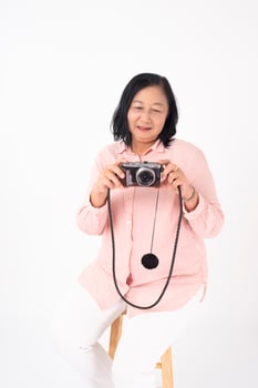 Asian older woman on white background, Travel concept photo
