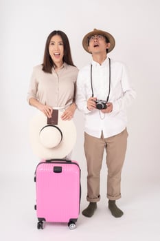 Asian couple tourists are enjoying  on white background photo