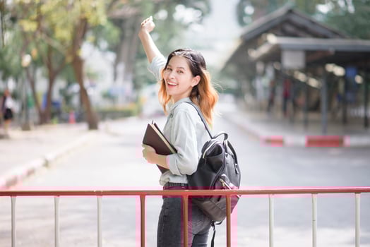 Happy young Asian University student. photo