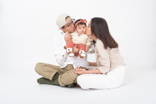 Happy Asian family on white background photo