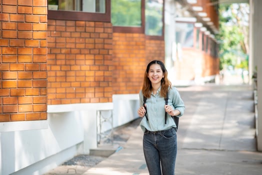 Happy young Asian University student. photo