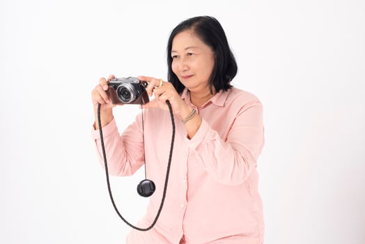 Asian older woman on white background, Travel concept photo