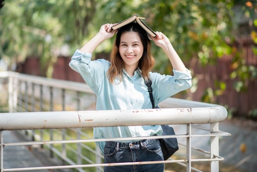 Happy young Asian University student. photo