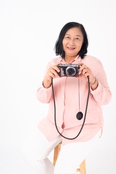 Asian older woman on white background, Travel concept photo