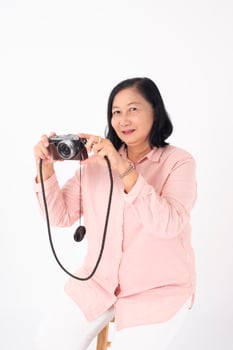 Asian older woman on white background, Travel concept photo