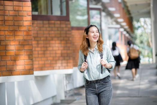 Happy young Asian University student. photo
