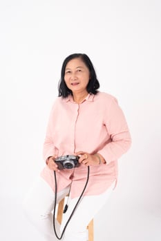 Asian older woman on white background, Travel concept photo