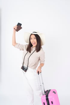 Beautiful Asian woman tourist  on white background photo