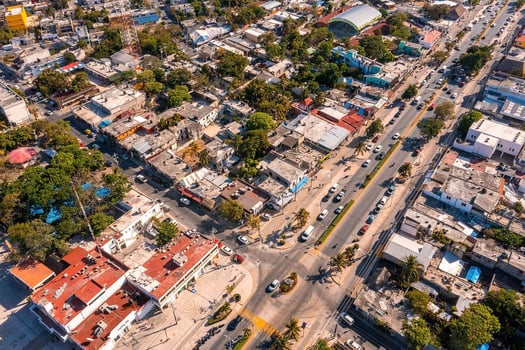Aerial view of the street intersection with cars driving down the road. photo