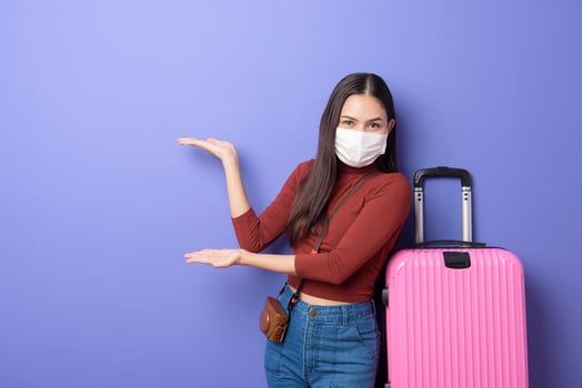 portrait of young traveler woman with face mask , New normal travel concept photo