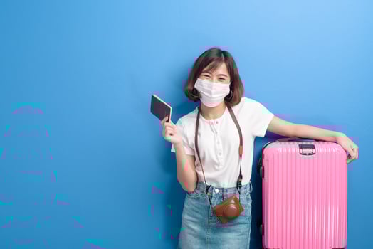 portrait of young traveler woman with face mask , New normal travel concept photo