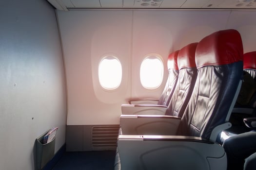 Aircraft cabin with empty passenger rows of seats. photo