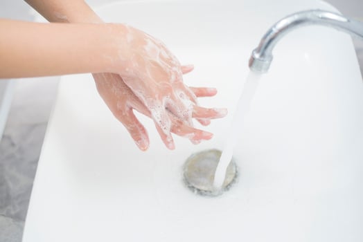 A woman is washing hands photo